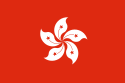 A flag with a white 5-petalled flower design on solid red background